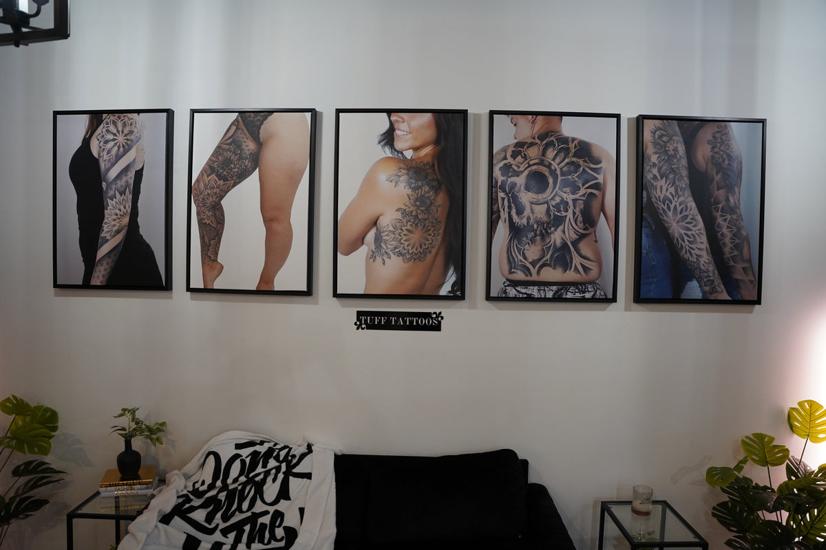 Tattoo artist and client at Tuff Tattoos studio in Tampa