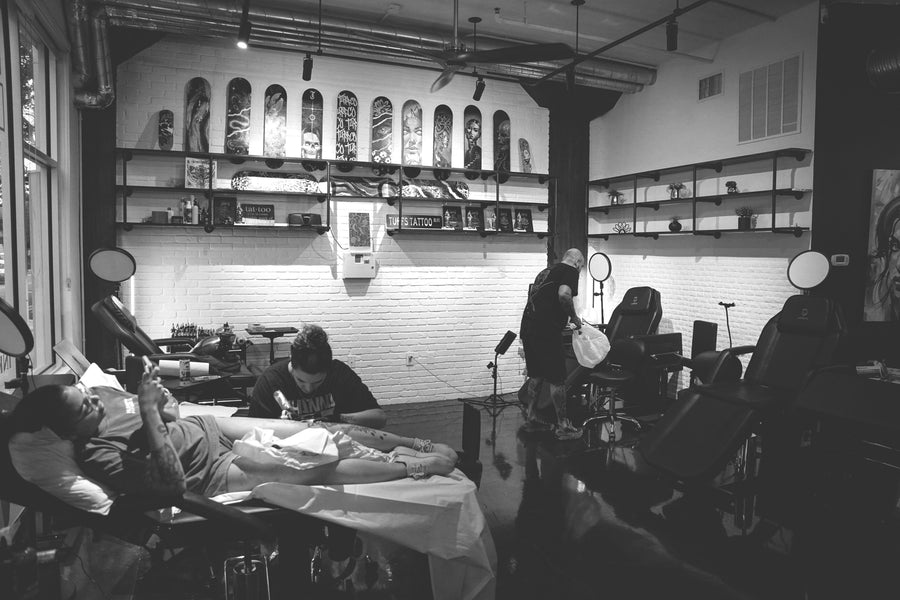 Tattoo artist consulting on a cover-up at Tuff Tattoos Tampa