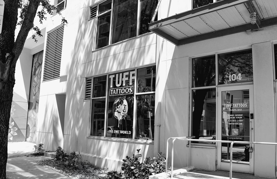Tattoo artist at work inside Tuff Tattoos, Channelside Tampa