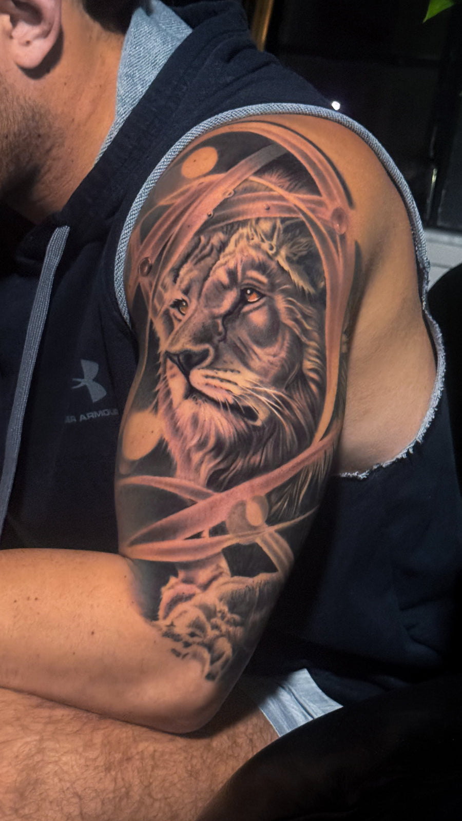 Black and grey realism lion tattoo by Carlos